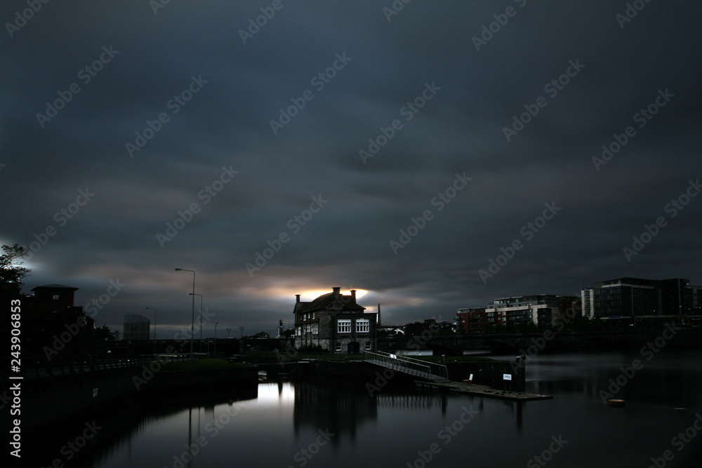 Limerick city lights out by sunset with single ambient light source