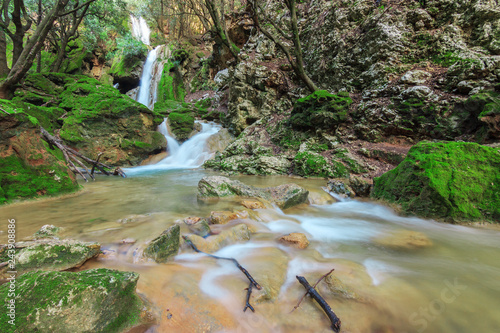 Salt des Freu waterfall in Majorca Balearic Islands. River flowing through a humid forest environment. photo