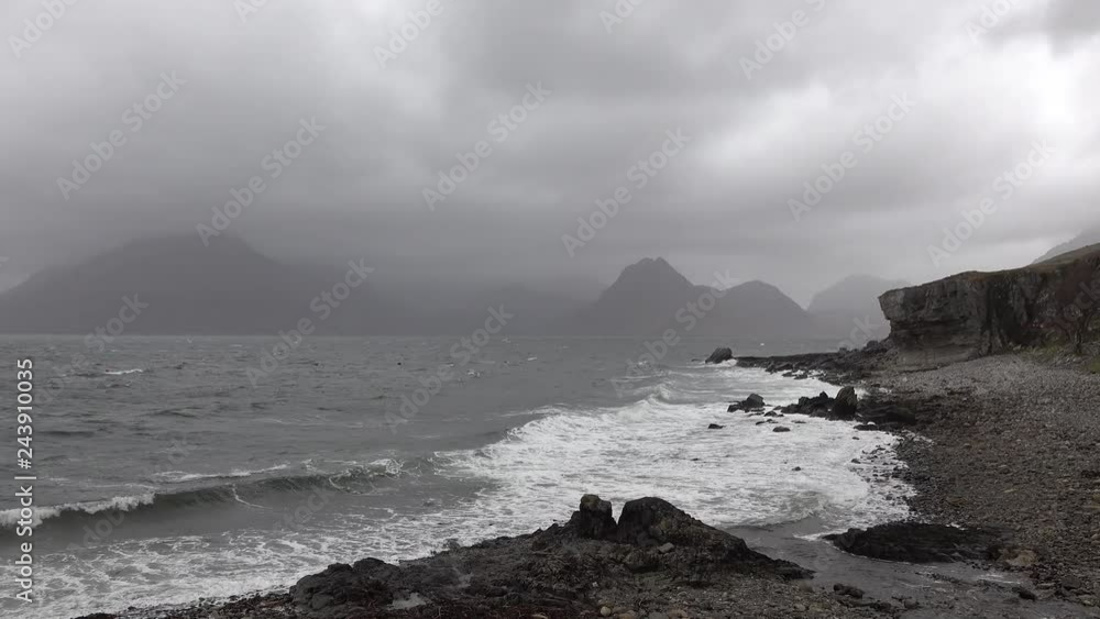 Elgol beach at Port na Cullaidh with Red Cuillin Mountains under clouds on Loch Scavaig Scottish Highlands Isle of Skye - Scotland UK Elgol beach at Port na Cullaidh with Red Cuillin Mountains under clouds on Loch Scavaig Scottish Highlands Isle of Skye - Scotland UK