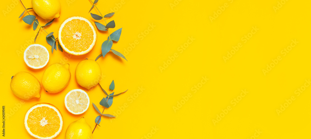 Ripe juicy lemons, orange and green eucalyptus twigs on bright yellow  background. Lemon fruit, citrus minimal concept, vitamin C. Creative summer  minimalistic background. Flat lay, top view copy space Stock Photo |