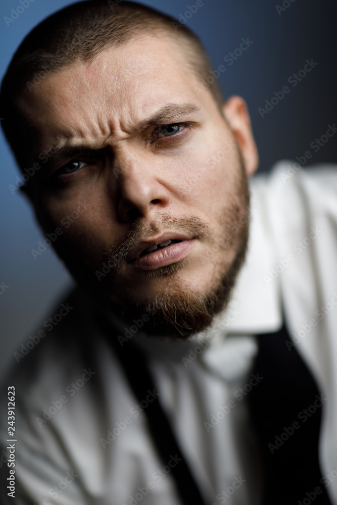 Obraz premium young bearded man in a white shirt and bow tie