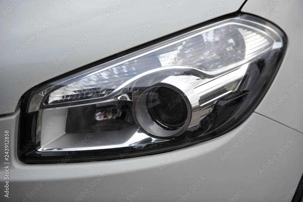 headlight of the main light of the white car, close-up. headlight of the main light of the white car, close-up.