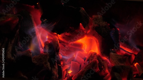 Smoldering glowing bright red fire coals