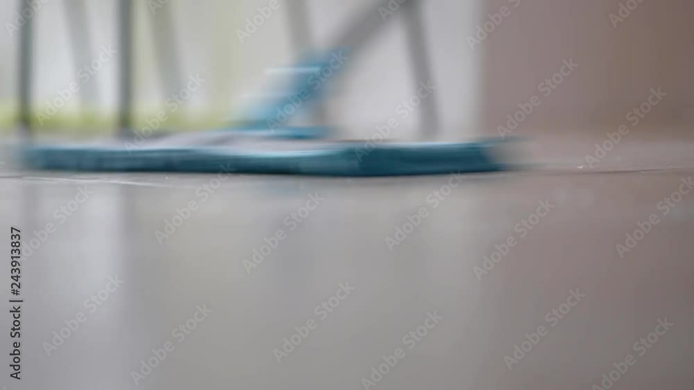 Young Woman with Mop, Cleaning Floor at Home. Housewife Wash the floor. Female Sweeps Dust in room and brings Order and Cleanliness in House - Housework and Housekeeping concept. Young Woman with Mop, Cleaning Floor at Home. Housewife Wash the floor. Female Sweeps Dust in room and brings Order and Cleanliness in House - Housework and Housekeeping concept.