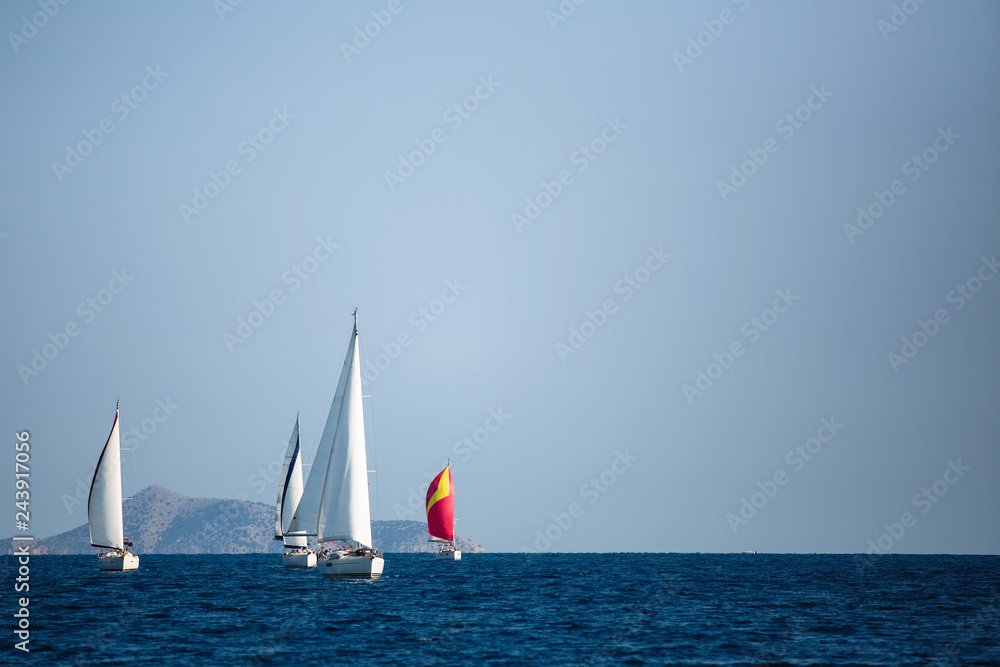 Luxury sailing boats participate in yacht regatta, Aegean Sea - Greece.