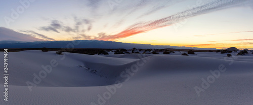 Beautiful panoramic view of white sand during a colorful sunrise. Taken in White Sands National Monument, New Mexico, United States.
