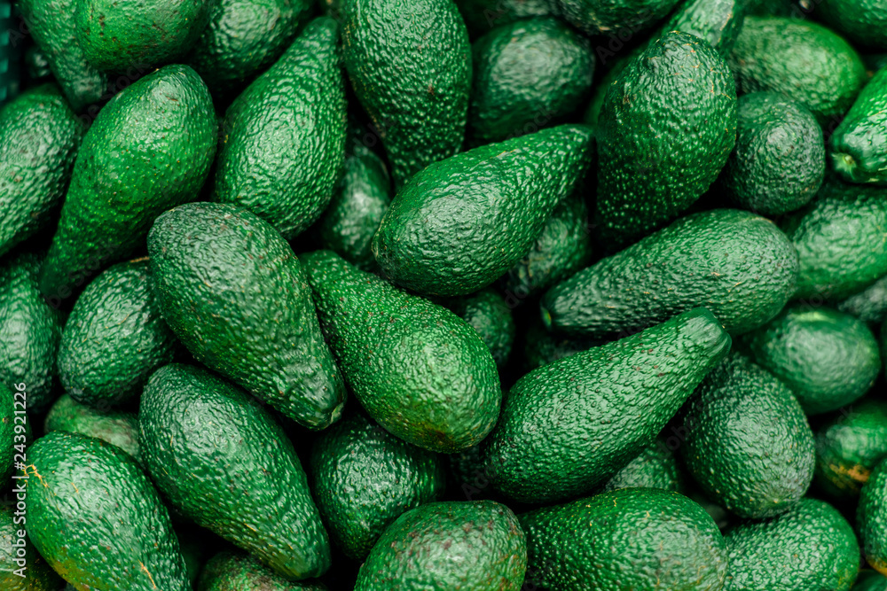 Fresh avocado on the market. Beautiful juicy avocado fruits lie on the