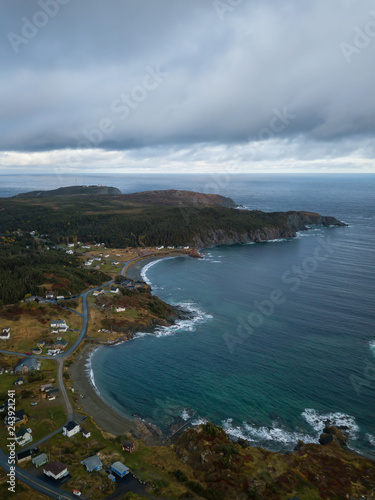 Aerial view of a small town on a rocky Atlantic Ocean Coast during a cloudy day. Taken in Paradise, Twillingate, Newfoundland, Canada. © edb3_16