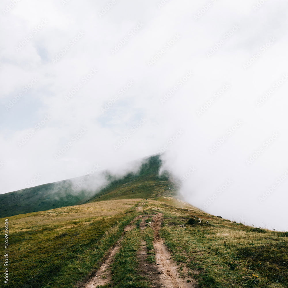 Foggy trail somewhere in the clouds. Carpathian mountains, Ukraine