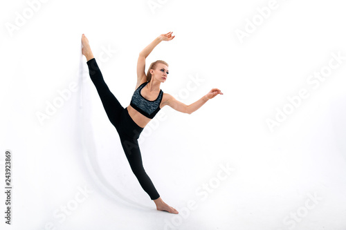 young athletic girl doing stretching © ZUYEVICH