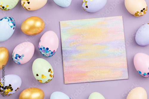 Pastel colorful Easter eggs decorated in sequins on pastel background  copy space. Happy Easter greeting card