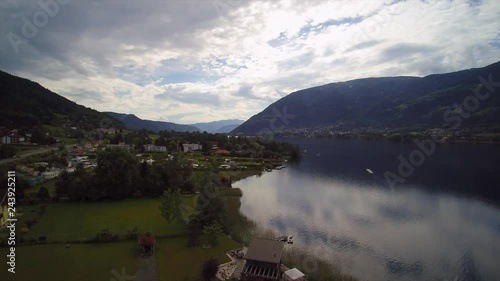 Aerial Drone View Of Austrian Lake Ossiacher Sea And Forest Mountains Town photo