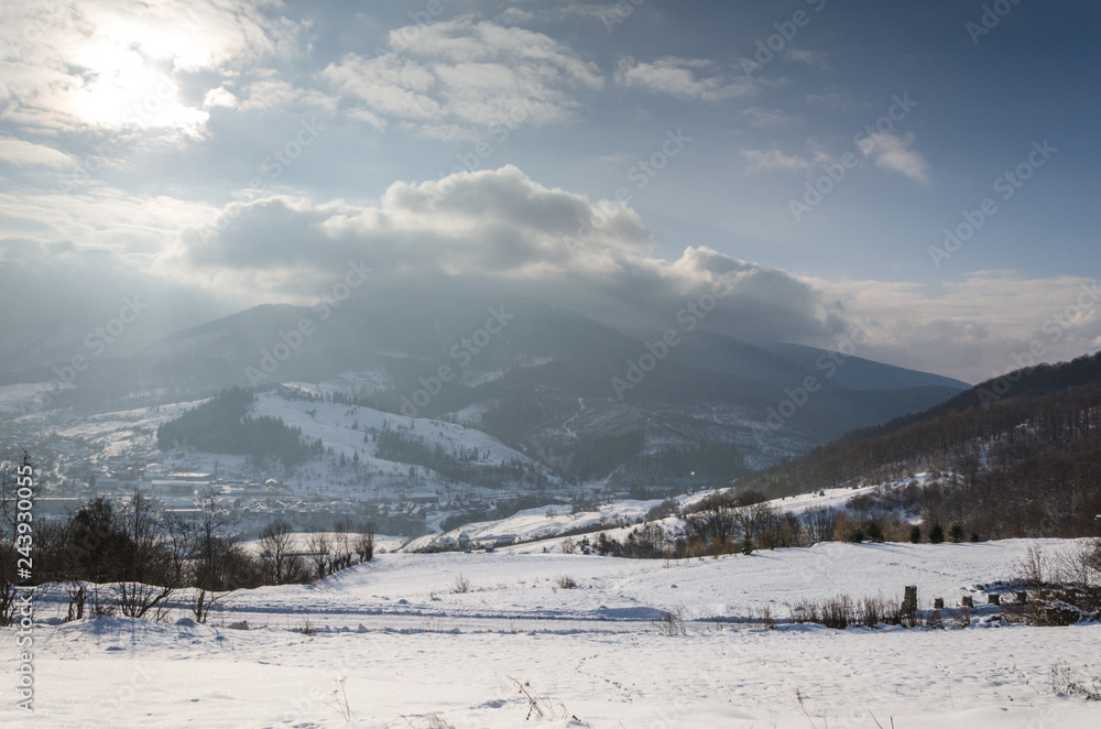 winter landscape, mountains covered with snow, break in winter