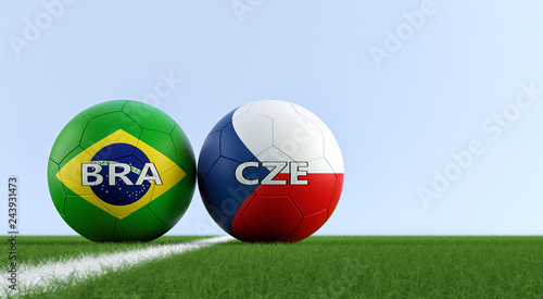 Brazil vs. Czech Republich Soccer Match - Soccer balls in Brazil and Czech Republic national colors on a soccer field. Copy space on the right side - 3D Rendering  photo