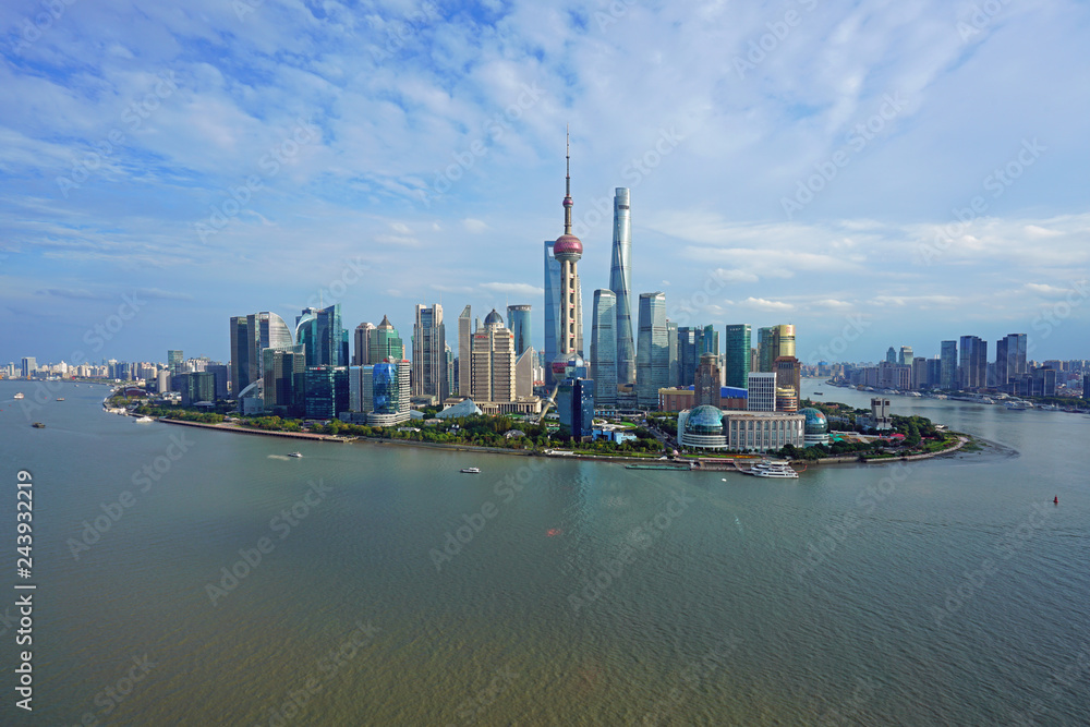 Naklejka premium Day view of the modern Pudong skyline seen from the Bund in Shanghai, China
