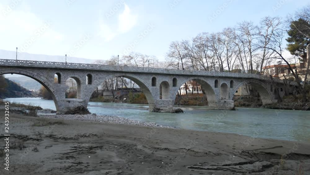 Berat, Albania: Gorica bridge on river Osum and traditional ottoman houses in Berat (mangalem and gorica district) with his thousand windows, an UNESCO world heritage site in Albania. Berat, Albania: Gorica bridge on river Osum and traditional ottoman houses in Berat (mangalem and gorica district) with his thousand windows, an UNESCO world heritage site in Albania.