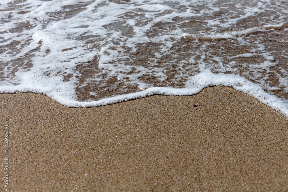 Closeup of Wave of the Sea on a Beach Closeup of Wave of the Sea on a Beach