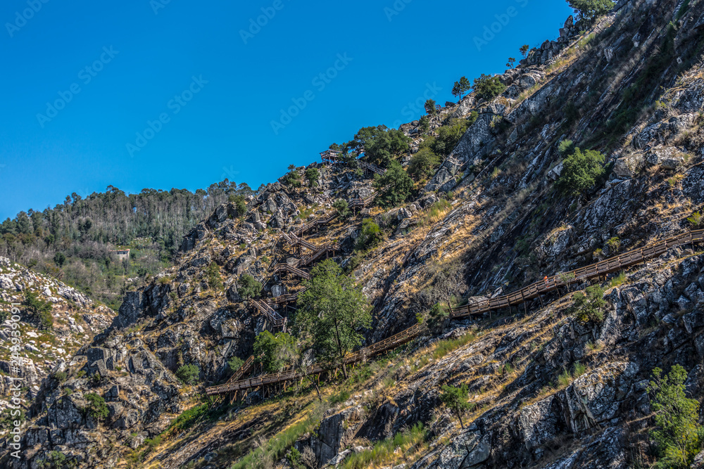 View of wooden suspended pedestrian walkway on mountains, overlooking the Paiva river