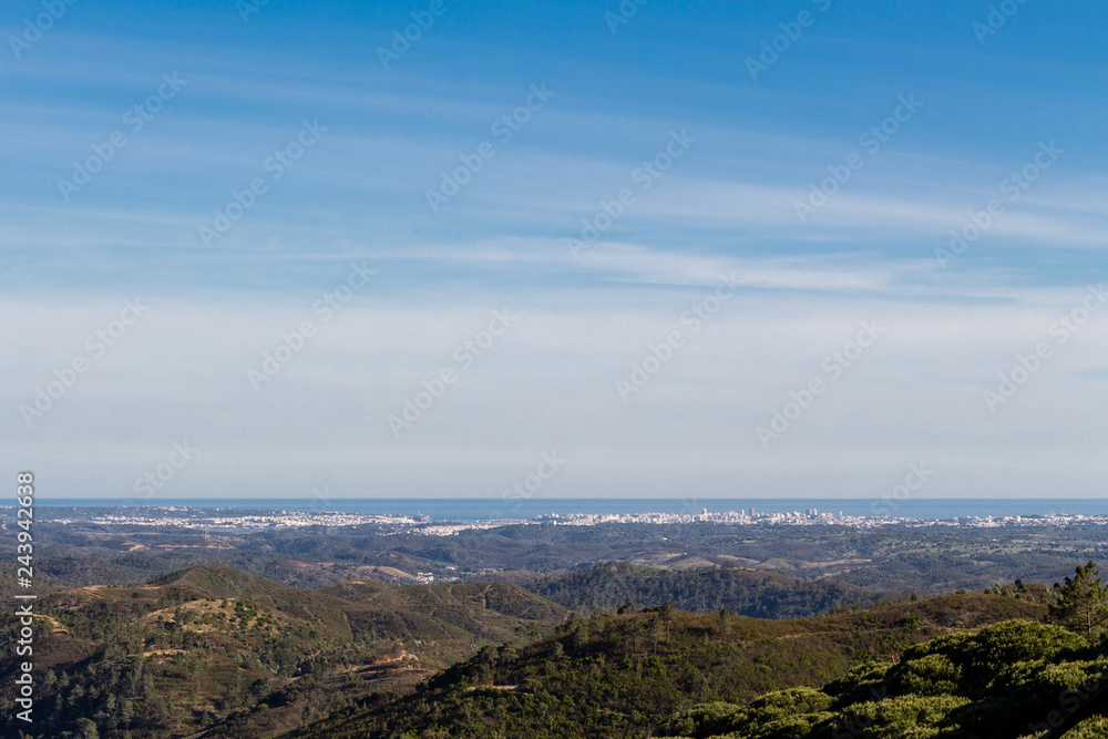 Beautiful nature landscape (panorama) and cityscape in Alentejo, Portugal. Beautiful hills and ocean in the far background. Beautiful nature landscape (panorama) and cityscape in Alentejo, Portugal. Beautiful hills and ocean in the far background.