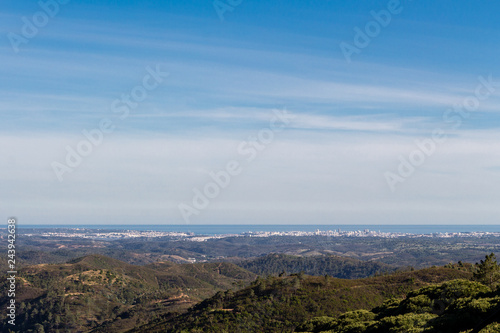 Beautiful nature landscape (panorama) and cityscape in Alentejo, Portugal. Beautiful hills and ocean in the far background.
