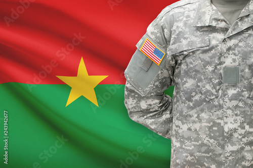 American soldier with flag on background - Burkina Faso