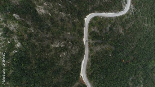 Car driving in the moutains bird's-eye view