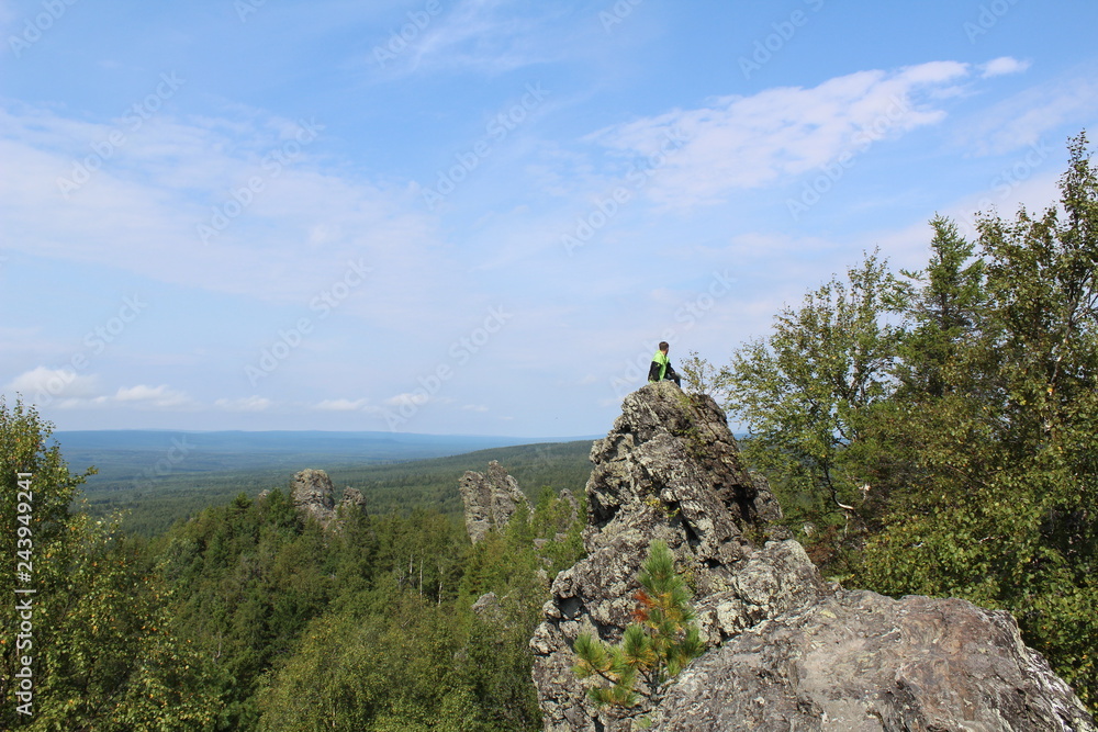 Fototapeta premium tourist on top of the mountain