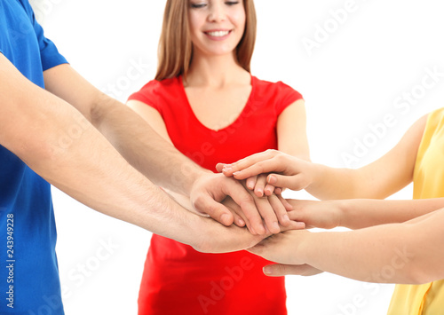 Young people putting hands ...