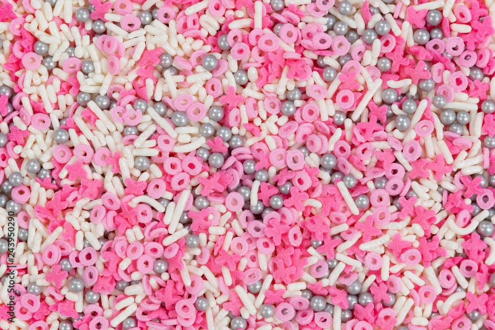 Pink, white and silver valentine x and o sprinkles macro background