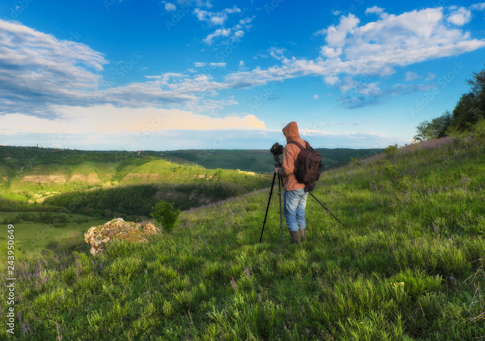 tourist on a cliff above the canyon. person on a cliff above the picturesque river. spring dawn
tourist on a cliff above the canyon. person on a cliff above the picturesque river. spring dawn