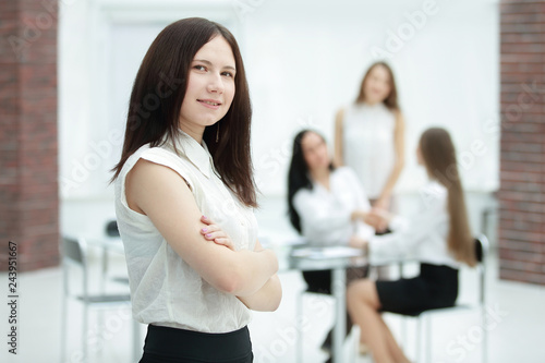 young employee on blurred office background.photo with copy space