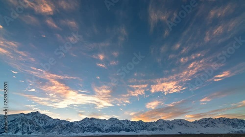 Timelapse of Heavenly Colorful Sunset Afterglow over Alpine Summit  photo