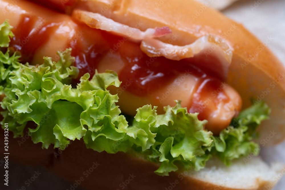Close-up view of got dog with bacon Close-up view of got dog with bacon