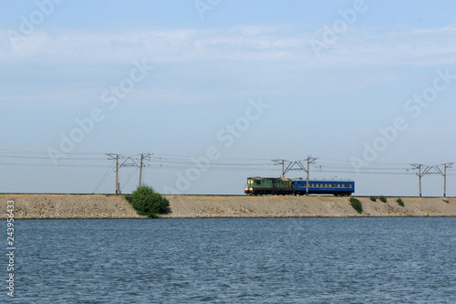 Train on causeway line at Kakhovka Water Reservoir, Ukraine