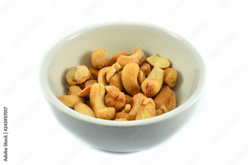 cashew nuts isolated on white bowl / cashew nuts roasted crispy cook roasted bean baked salt