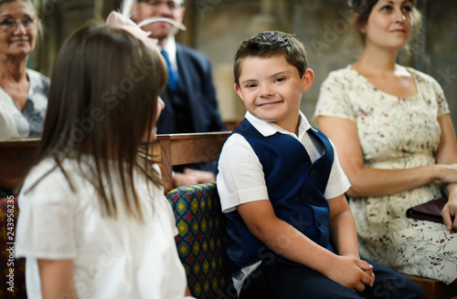 Cute little boy waiting for the bride to arrive