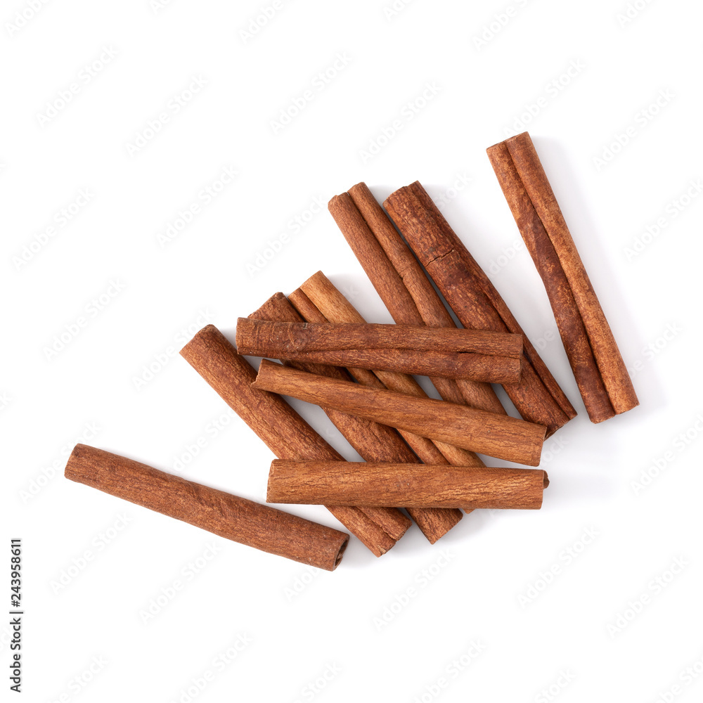 Cinnamon sticks isolated on white background closeup. Canella spice. Aromatic condiment background. Flat lay, top view.