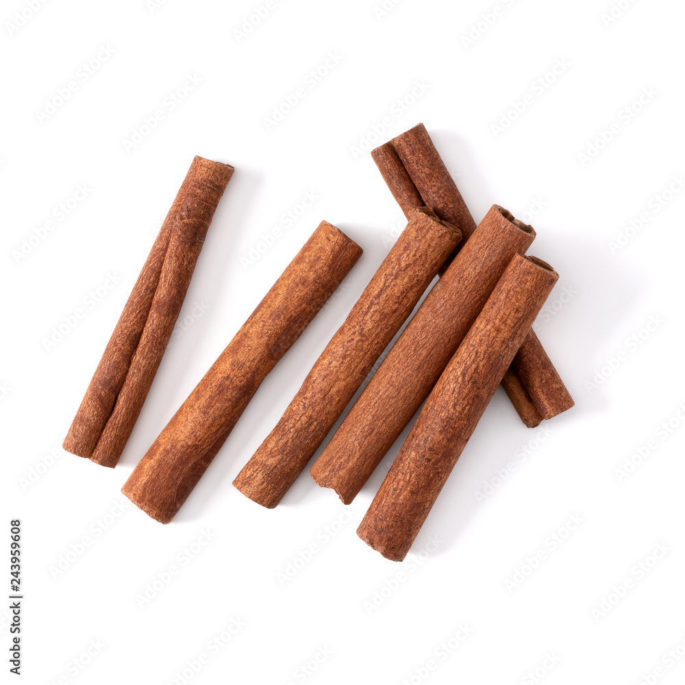 Cinnamon sticks isolated on white background closeup. Canella spice. Aromatic condiment background. Flat lay, top view. Cinnamon sticks isolated on white background closeup. Canella spice. Aromatic condiment background. Flat lay, top view.