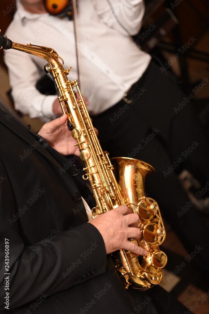 Naklejka premium Man plays the saxophone