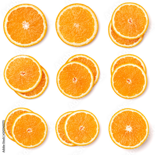 Seamless pattern of orange fruit slices. Orange slices isolated on white background. Food background. Flat lay  top view.