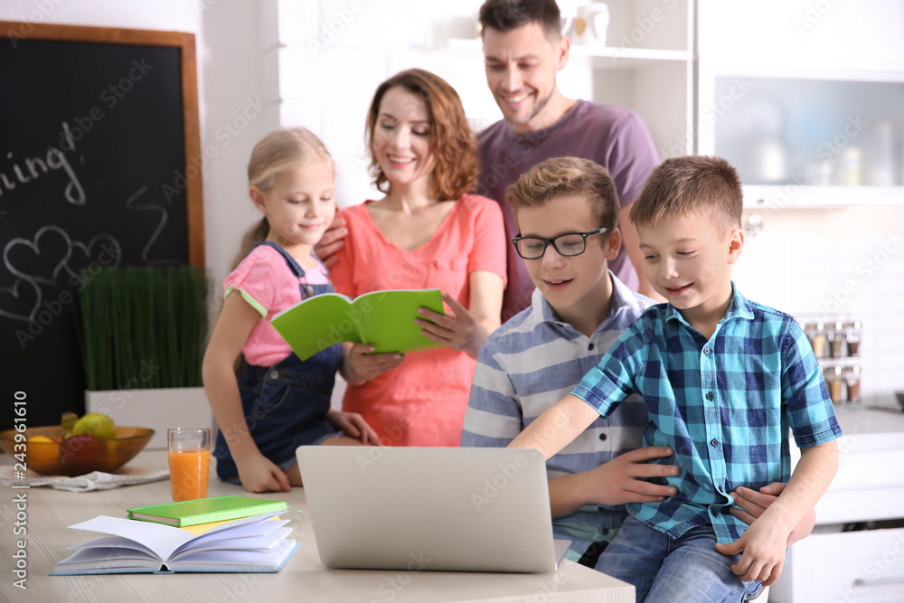 Children with parents doing homework at home