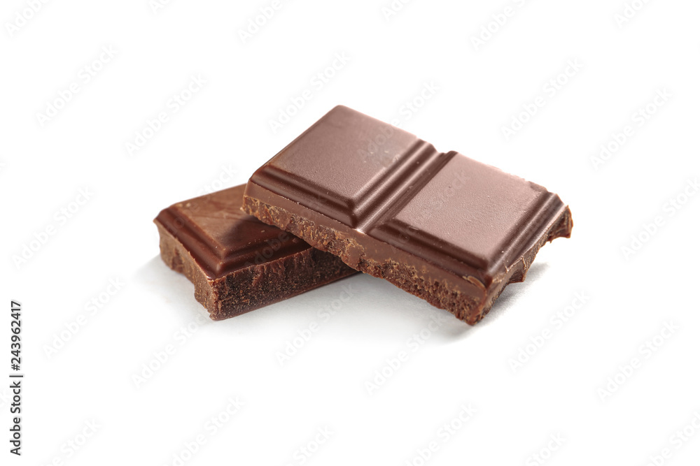 Pieces of tasty milk chocolate on white background Pieces of tasty milk chocolate on white background