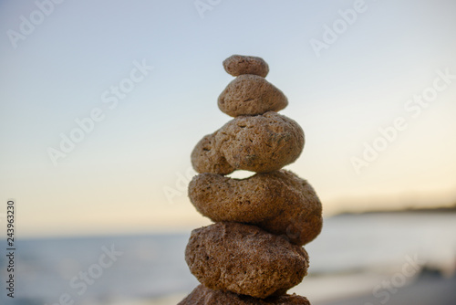 Stones balance on beach, sunset shot