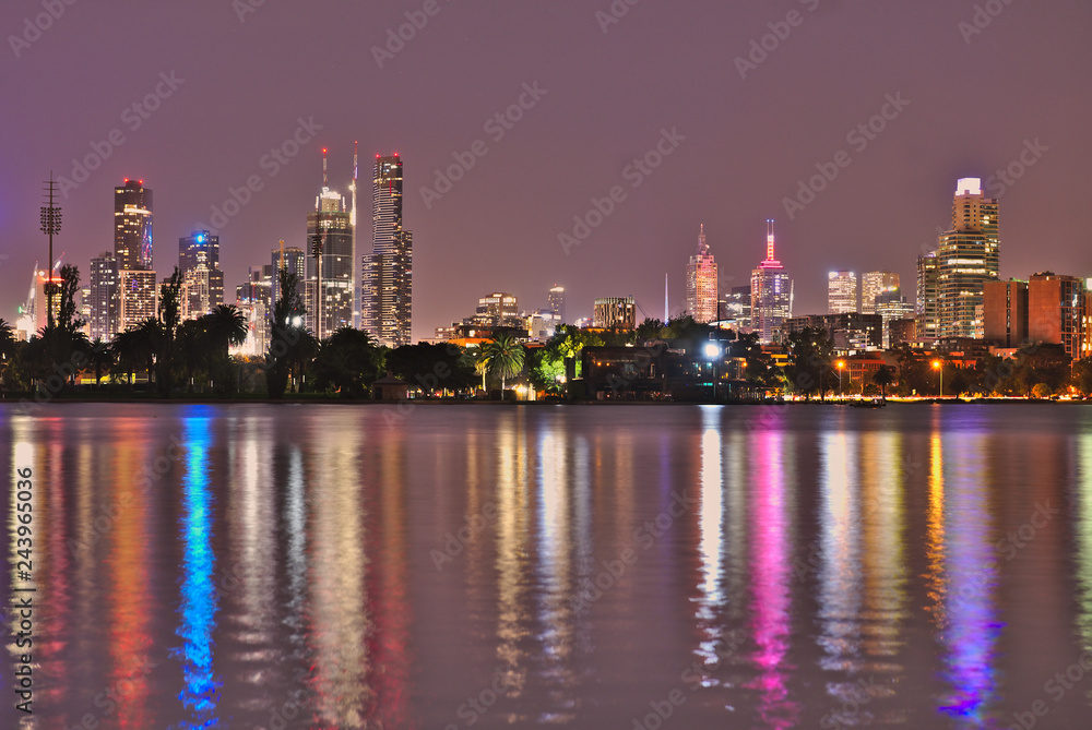 Fototapeta premium The Melbourne Skyline at night as seen from Albert Park Lake