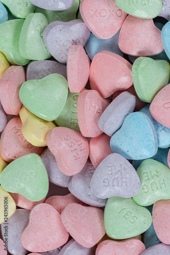 Pastel colored candy hearts macro background Stock Photo