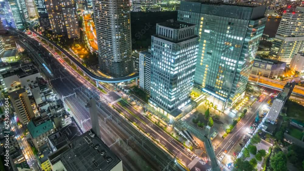 Timelapse Overview of City Transit below Tokyo Skyline at Night -Tilt Up- Timelapse Overview of City Transit below Tokyo Skyline at Night -Tilt Up-