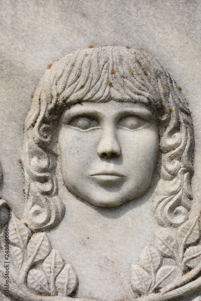 BISTRITA, ROMANIA, statue in cemetery,  BABY  FACE   SCULPTURE