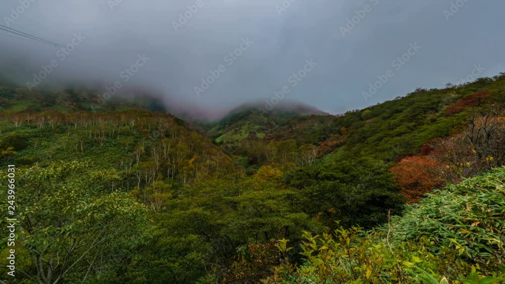 Timelapse of Fog Revealing Fall Colored Mountain Summit -Zoom In- Timelapse of Fog Revealing Fall Colored Mountain Summit -Zoom In-