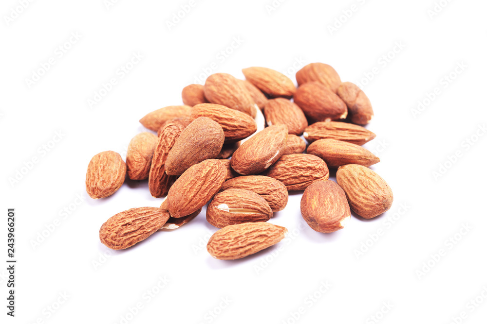 Almond isolated. Group of nuts on white background. Pile of almonds seeds collection. Shallow depth of field. Flat lay, top view. Almond isolated. Group of nuts on white background. Pile of almonds seeds collection. Shallow depth of field. Flat lay, top view.