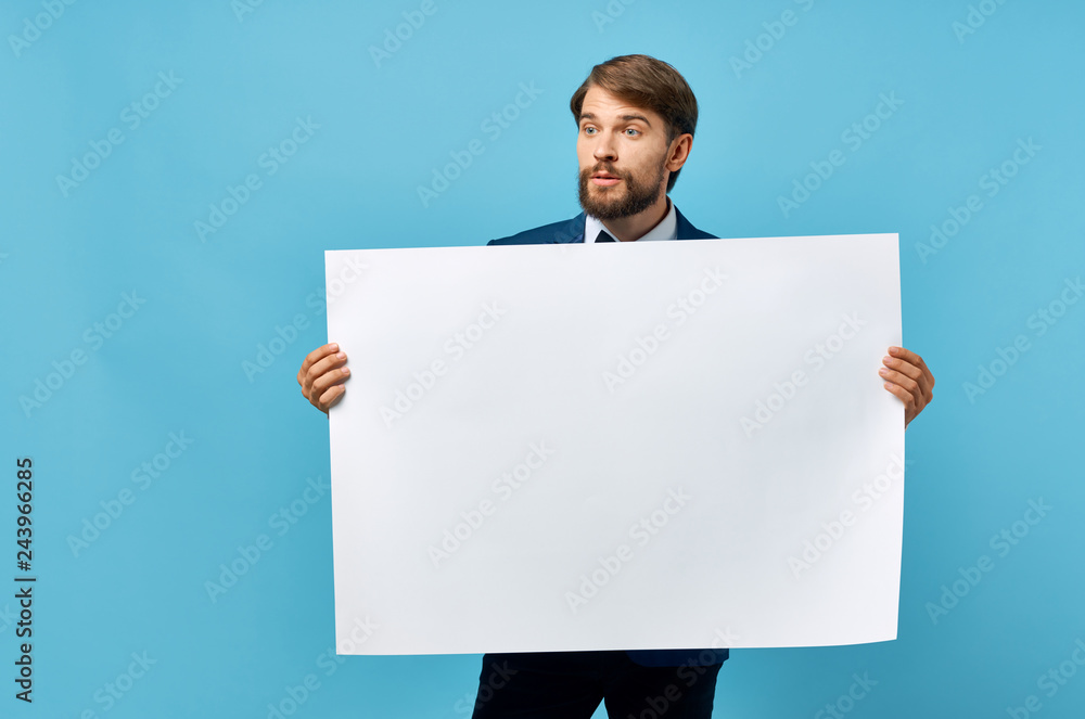 man with a beard holding a white background man with a beard holding a white background